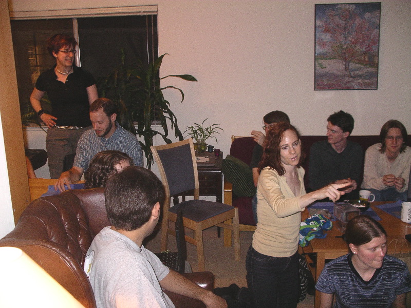 Molly surveys her party as Jill explains something